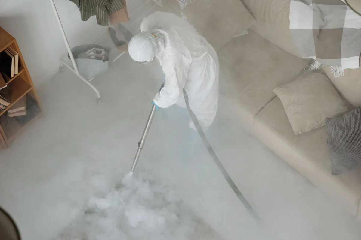 Biohazard cleanup technician in protective equipment, Irondale, AL